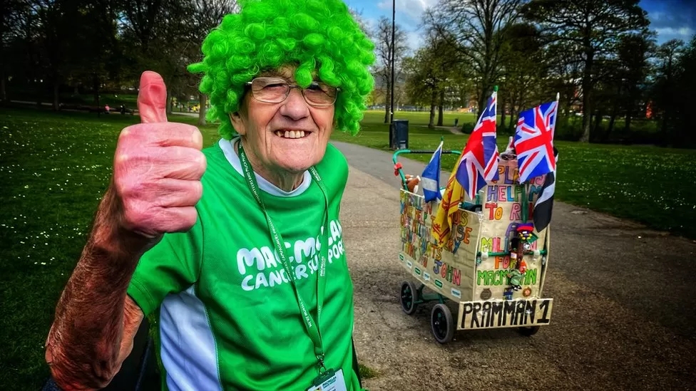 John Burkhill in a green outfit raising money for macmillan cancer
